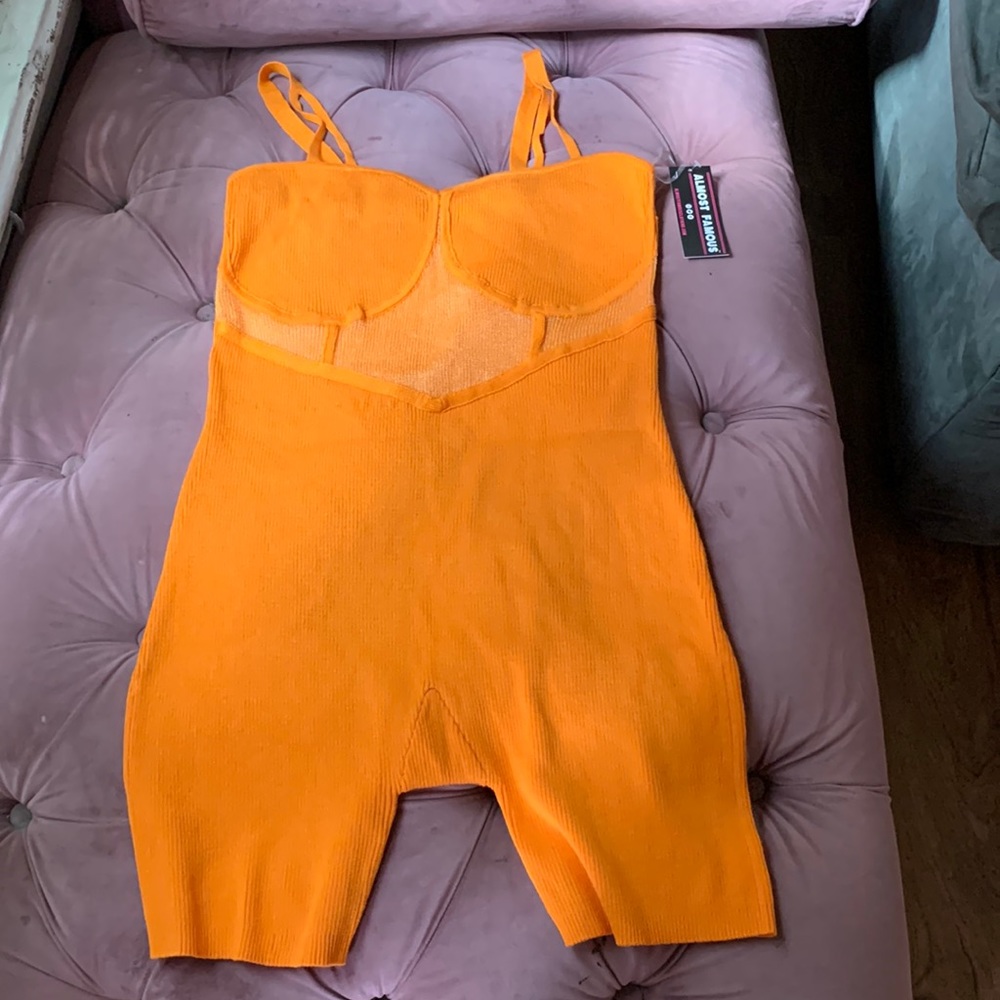 Orange romper or jumper (1 piece)